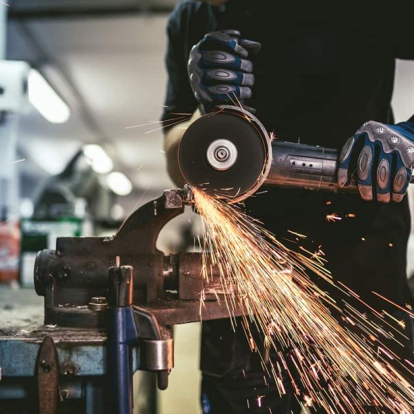 missouri worker cutting steel with grinder