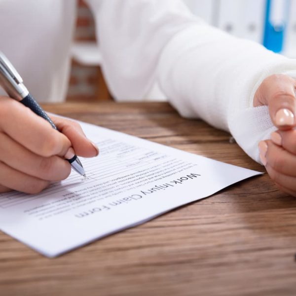 injured worker filling out paper work