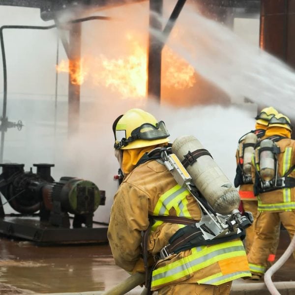 firefighters at the scene of a workplace explosion