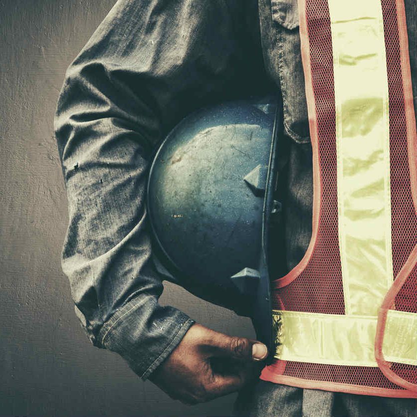 Missouri worker holding hard hat