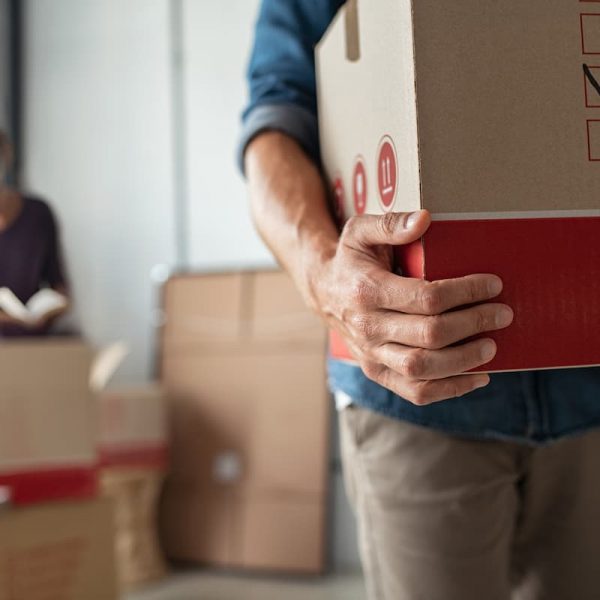 man carrying moving box