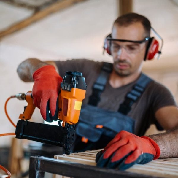 missouri construction worker using a nail gun