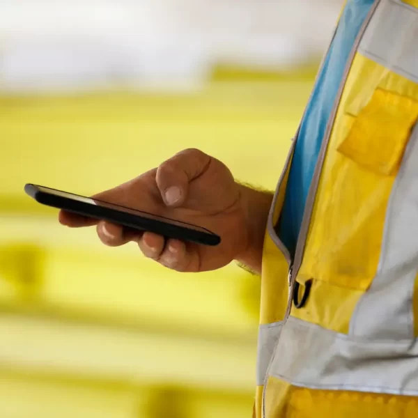 construction worker checking their smartphone