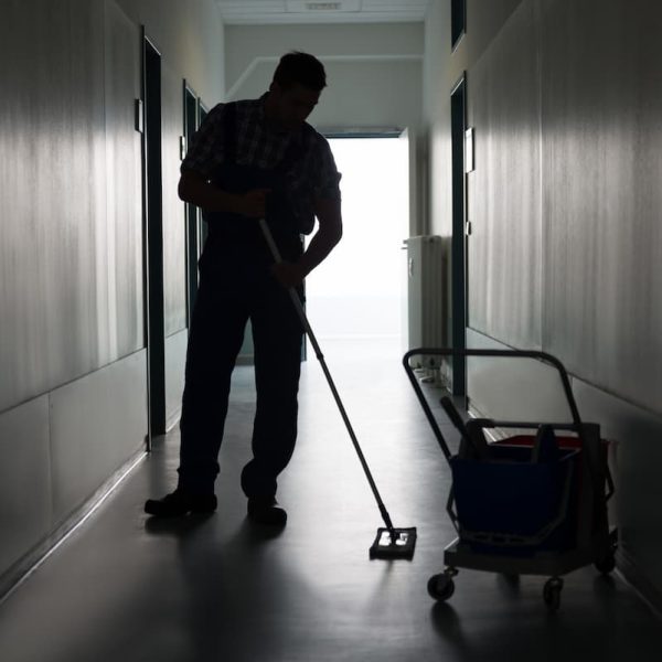 St. Louis janitor cleaning hallway floor