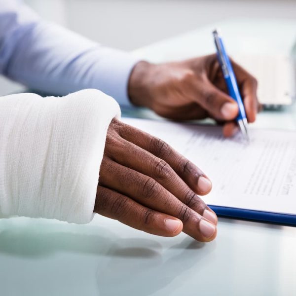 injured worker filing out workers comp paperwork