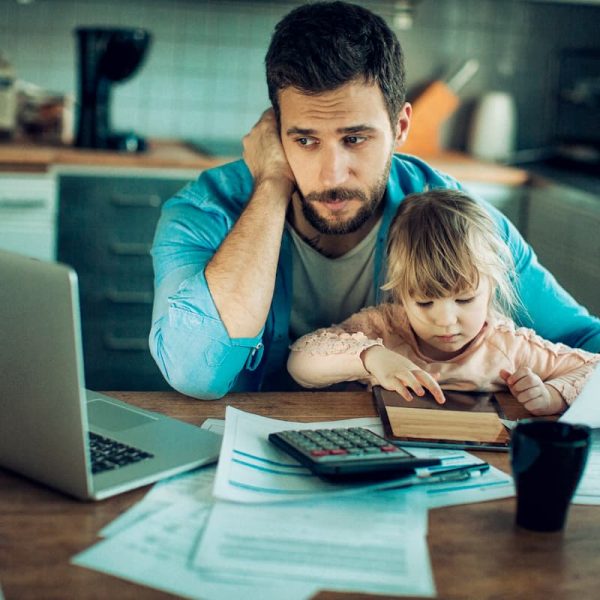 stressed injured worker reviewing insurance documents